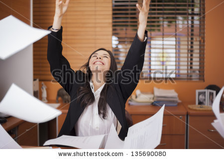 stock-photo-happy-businesswoman-tossing-papers-in-the-air-excited-about-something-135690080